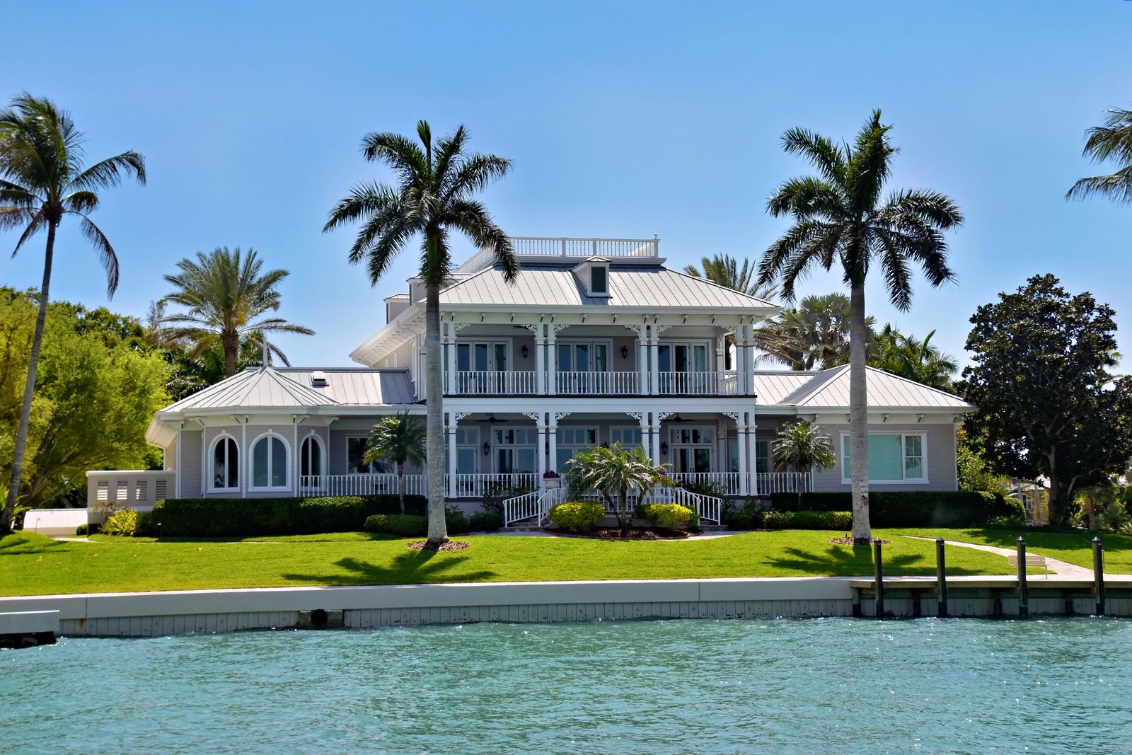 Classic white waterfront home in Naples Florida